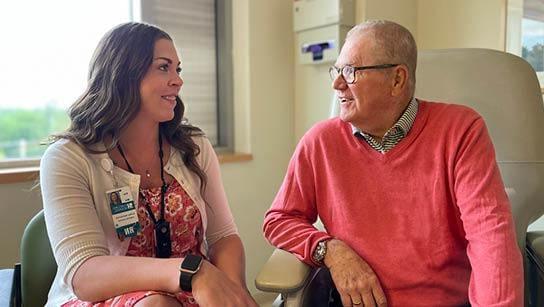 Nurse navigator and patient 